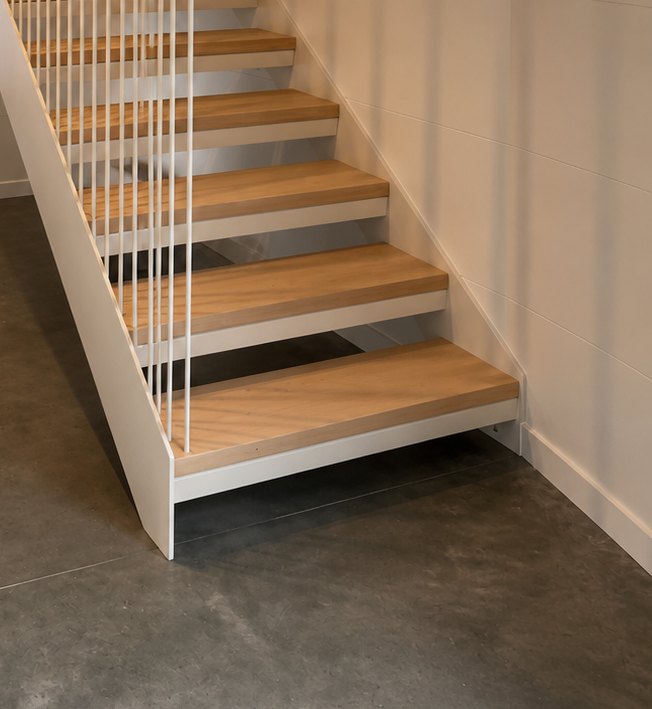Solid oak treads cantilevering from a white steel stringer with open risers, Cass Bay, Christchurch