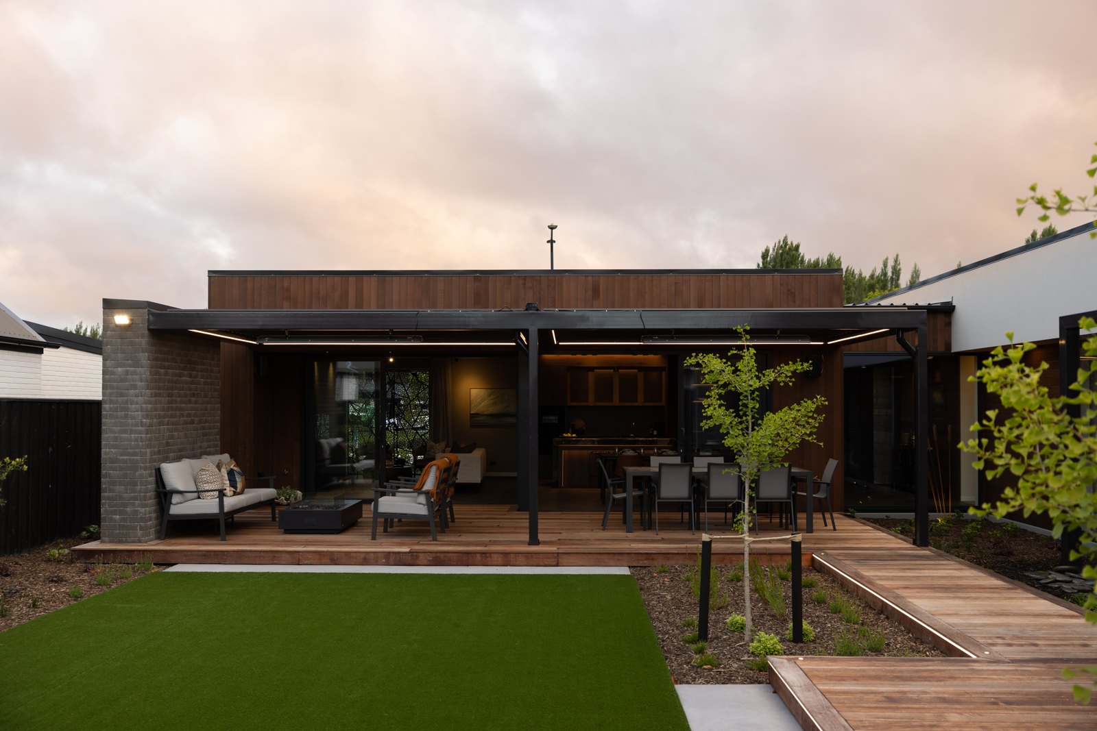 Steel pergola framing the backyard and lawn at the Hallmark Homes Oakbridge showhome