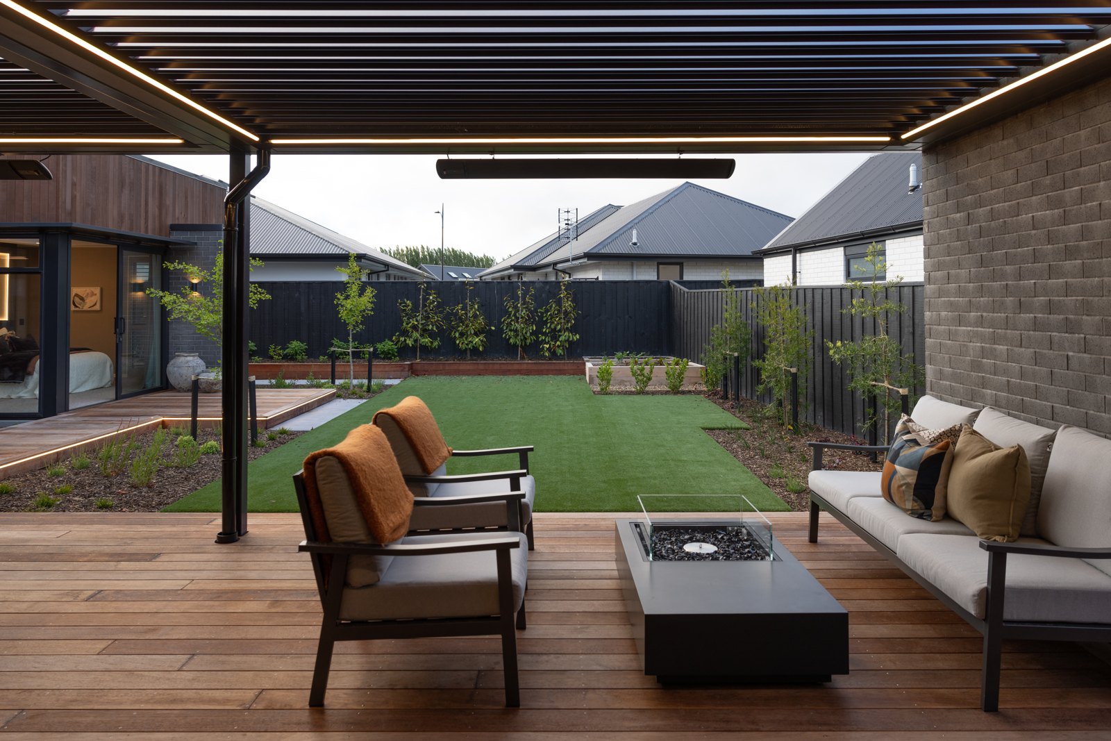 Steel louvred pergola over an outdoor room at the Hallmark Homes Oakbridge showhome, Christchurch